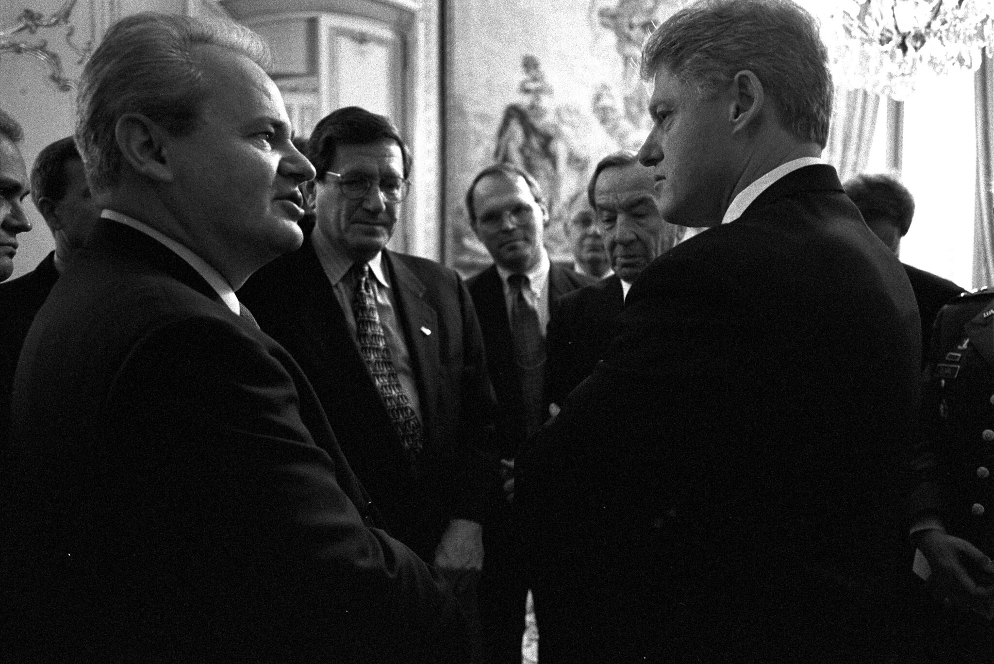 Dec. 14, 1995: U.S. President Bill Clinton, right, talking with Serbian President Slobodan Milosevic in Paris with onlookers Ambassador Richard Holbrooke, Secretary of State Warren Christopher, General Wesley Clark.  (C.I.A., Public domain, Wikimedia Commons)